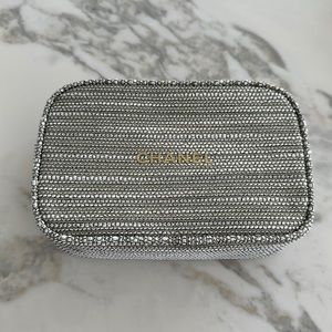 Chanel cosmetic bag in tweed and gold letters